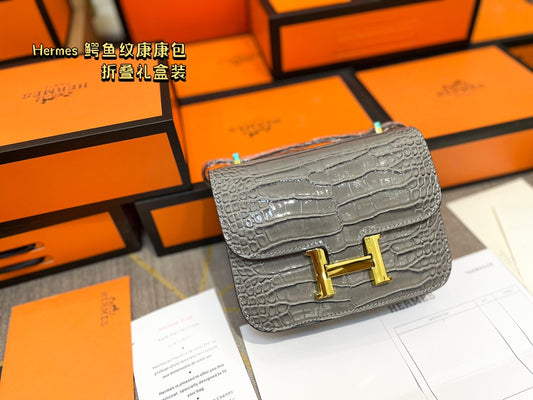 Crocodile-print Hermès Constace Concan bag.