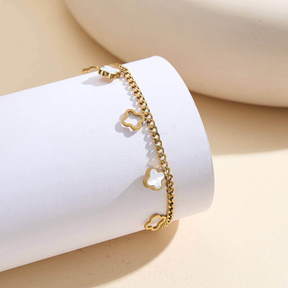 Aura Celestial gold lucky clover charm bracelet with natural white shell mother of pearl and open-work hollow geometric clovers in waterproof 304 stainless steel by LeeWey Luxury