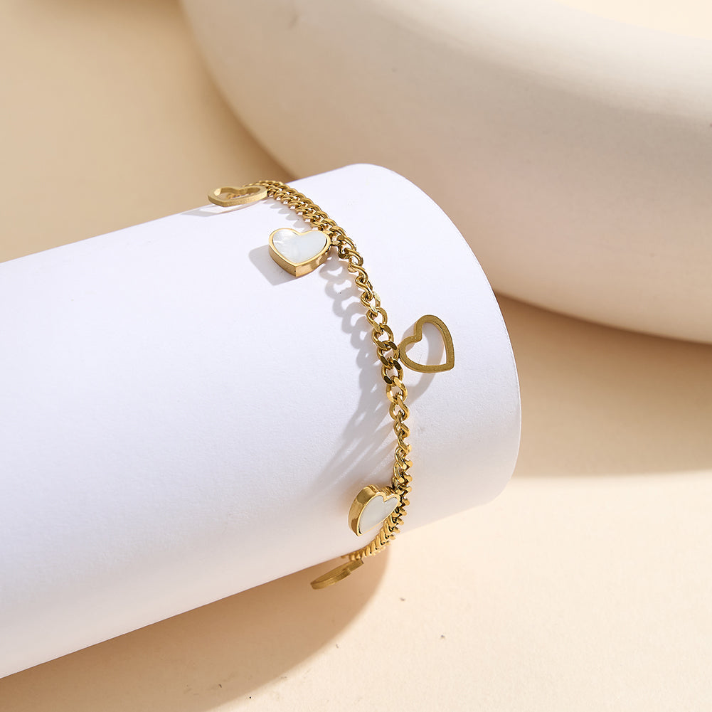 Aura Amour gold lucky heart charm bracelet with natural white shell mother of pearl and open-work hollow geometric hearts in waterproof 304 stainless steel by LeeWey Luxury
