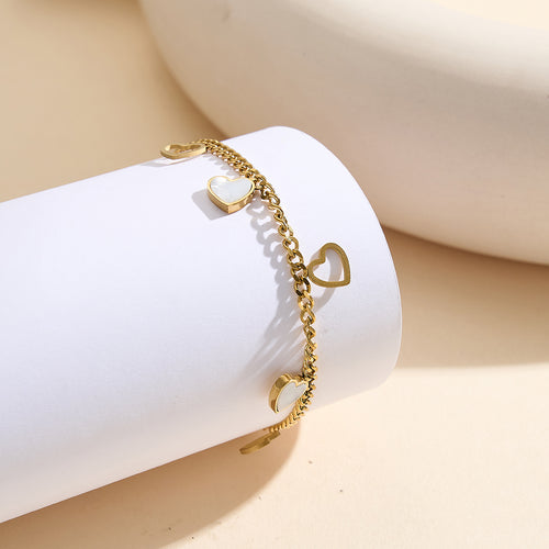 Aura Amour gold lucky heart charm bracelet with natural white shell mother of pearl and open-work hollow geometric hearts in waterproof 304 stainless steel by LeeWey Luxury