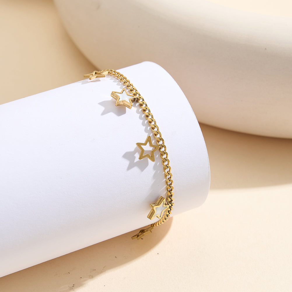 Aura Celestial gold lucky star charm bracelet with natural white shell mother of pearl and open-work hollow geometric stars in waterproof 304 stainless steel by LeeWey Luxury