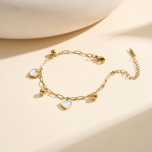 Aura Amour gold lucky heart charm bracelet with natural white shell mother of pearl and polished metallic bead accents in waterproof 304 stainless steel by LeeWey Luxury