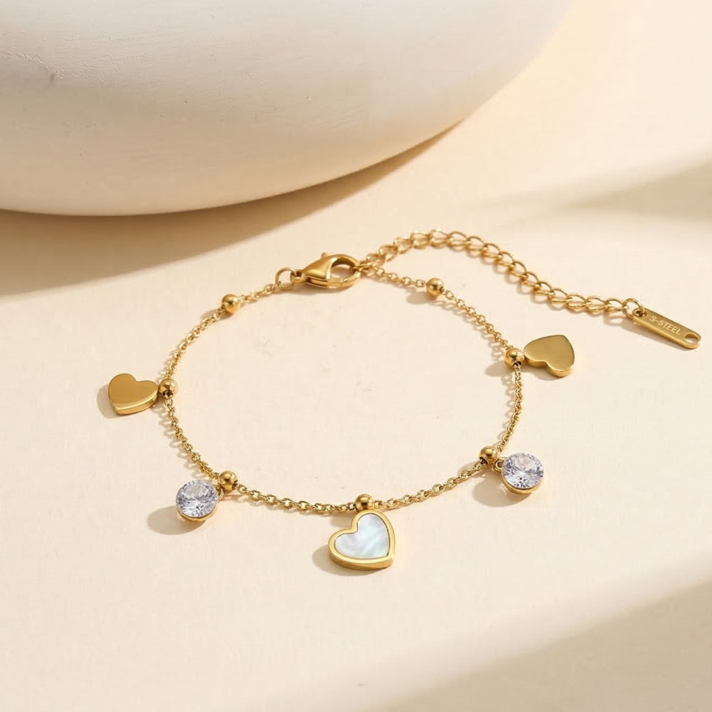 Aura Amour gold mixed charm bracelet with 12mm natural white shell mother of pearl heart round cubic zirconia crystals and polished metal hearts in waterproof 304 stainless steel by LeeWey Luxury