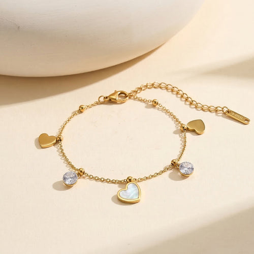 Aura Amour gold mixed charm bracelet with 12mm natural white shell mother of pearl heart round cubic zirconia crystals and polished metal hearts in waterproof 304 stainless steel by LeeWey Luxury