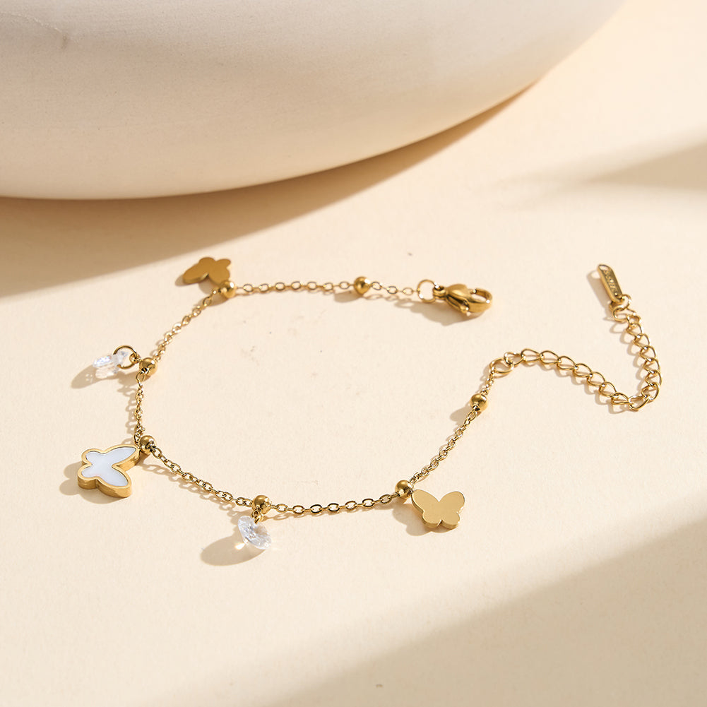 Aura Celestial gold mixed charm bracelet with 14mm natural white shell mother of pearl butterfly round cubic zirconia crystals and polished metal butterflies in waterproof 304 stainless steel by LeeWey Luxury