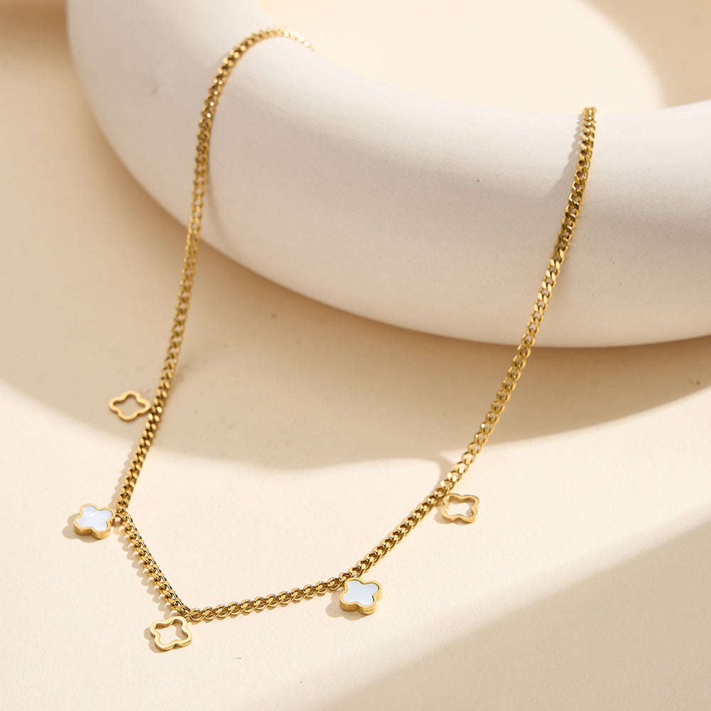 Aura Celestial gold lucky clover charm necklace with natural white shell mother of pearl and open-work hollow geometric clovers in waterproof tarnish-free 304 stainless steel by LeeWey Luxury