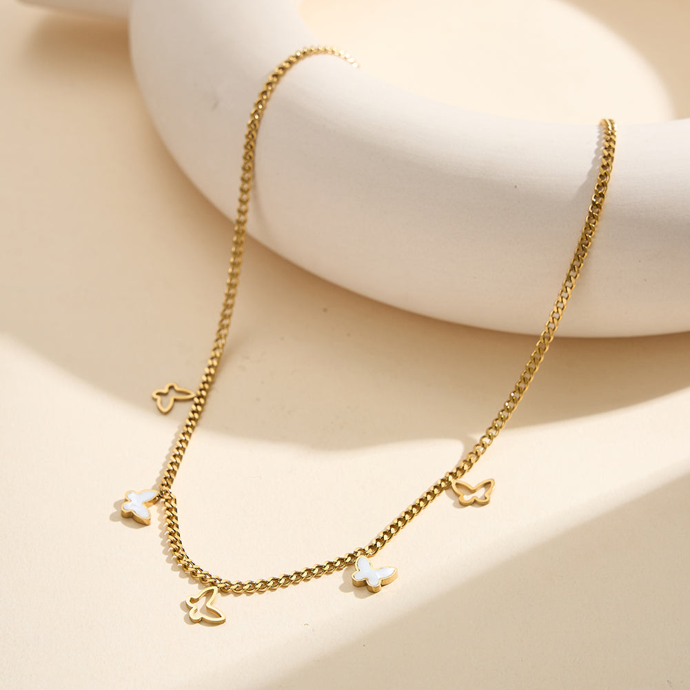 Aura Celestial gold lucky butterfly charm necklace with natural white shell mother of pearl and open-work hollow geometric butterflies in waterproof tarnish-free 304 stainless steel by LeeWey Luxury