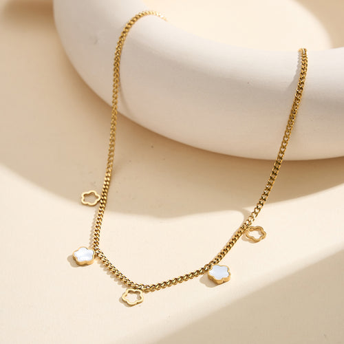 Aura Blossom gold lucky flower charm necklace with natural white shell mother of pearl and open-work hollow geometric daisies in waterproof tarnish-free 304 stainless steel by LeeWey Luxury