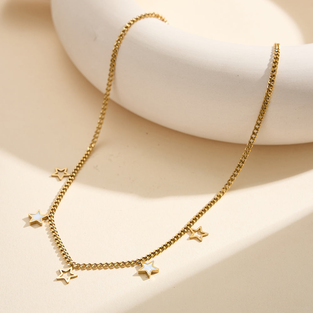 Aura Celestial gold lucky star charm necklace with natural white shell mother of pearl and open-work hollow geometric stars in waterproof tarnish-free 304 stainless steel by LeeWey Luxury