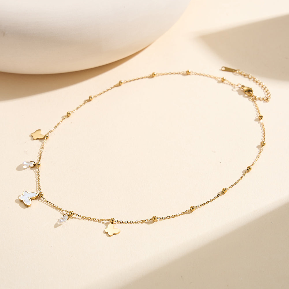 Aura Celestial gold mixed charm necklace with 14mm natural white shell mother of pearl butterfly round cubic zirconia crystals and polished metal butterflies in waterproof 304 stainless steel by LeeWey Luxury